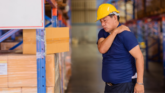 construction worker holding his shoulder